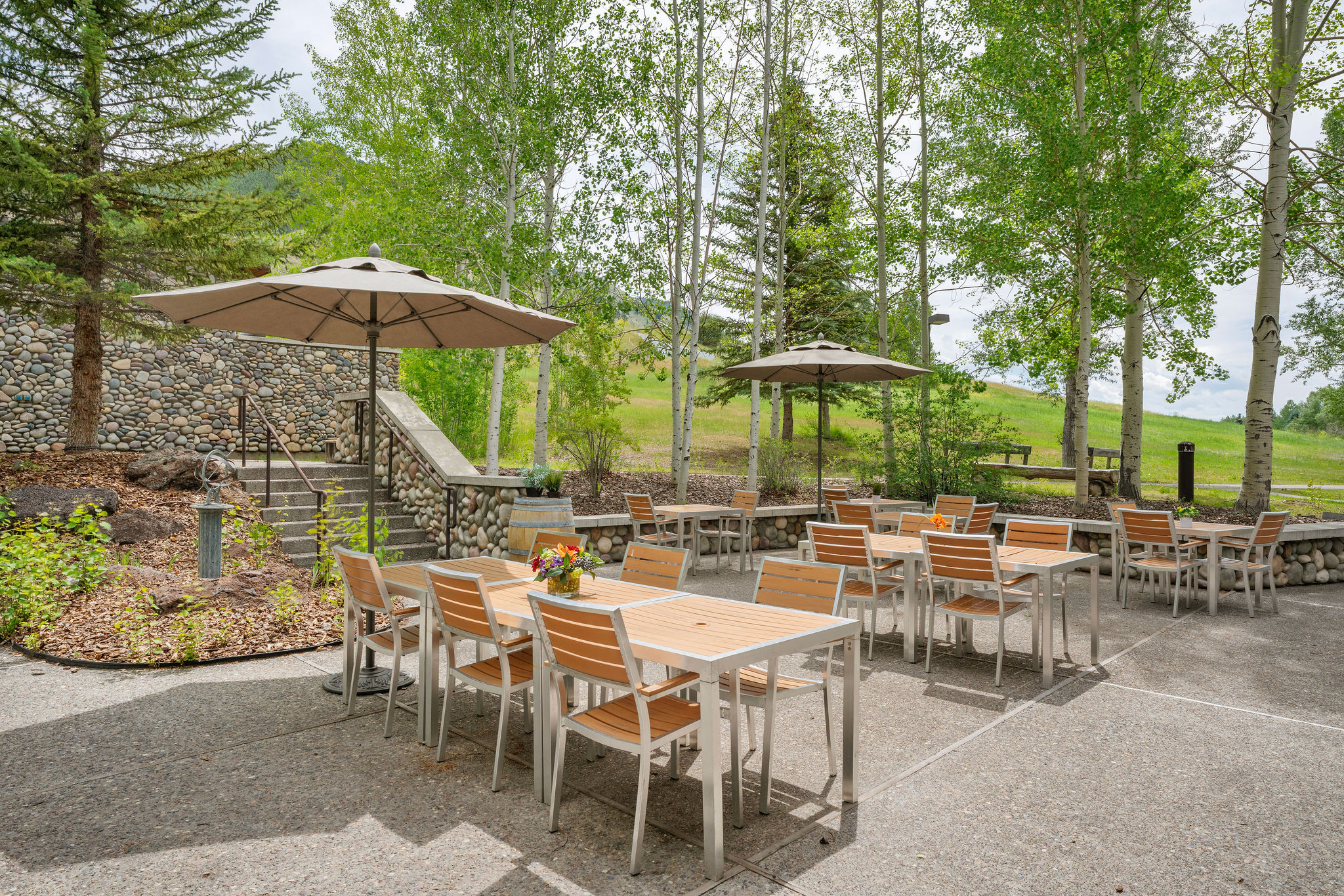 Outdoor tables and umbrellas at Legacy Lodge
